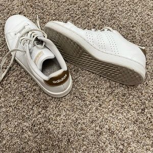 white and gold Adidas shoes